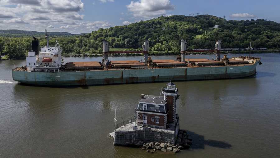 FILE - A ship passes by the Hudson-Athens Lighthouse, Wednesday, June 12, 2024, in Hudson, New York.