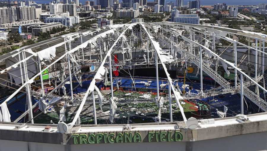 FILE - The roof of the Tropicana Field is damaged the morning after Hurricane Milton hit the region, Thursday, Oct. 10, 2024, in St. Petersburg, Fla. (AP Photo/Mike Carlson, File)