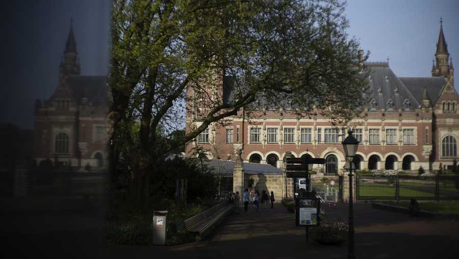 The Peace Palace housing the World Court, or International Court of Justice, is reflected in a monument in The Hague, Netherlands, on Wednesday, May 1, 2024. (AP Photo/Peter Dejong, File)