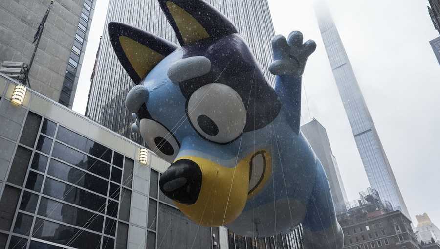 Handlers guide the Bluey balloon down Sixth Avenue during the Macy&apos;s Thanksgiving Day Parade, Thursday, Nov. 28, 2024, in New York. (AP Photo/Julia Demaree Nikhinson)