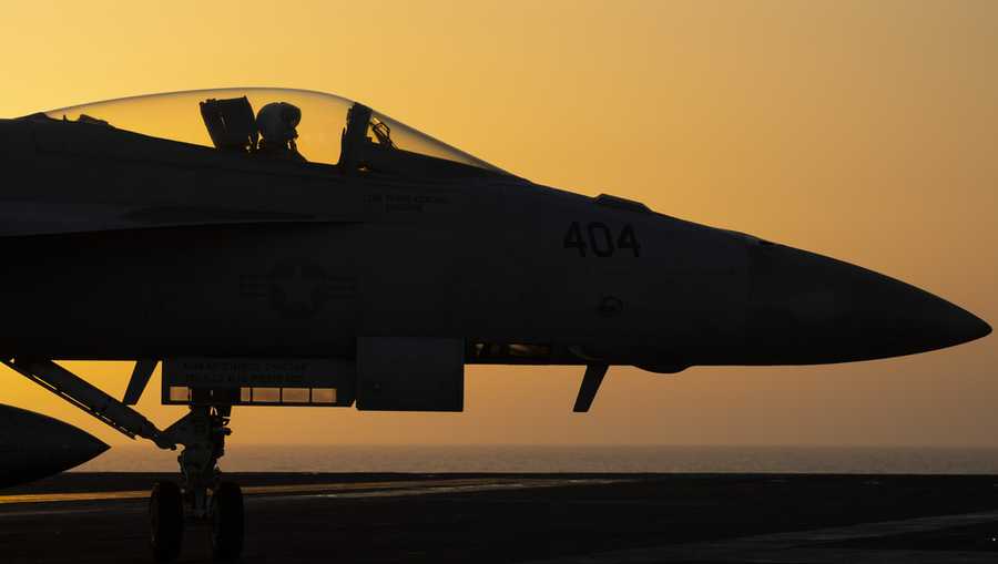 FILE - A fighter jet maneuvers on the deck of the USS Dwight D. Eisenhower in the Red Sea, June 11, 2024. (AP Photo/Bernat Armangue, File)