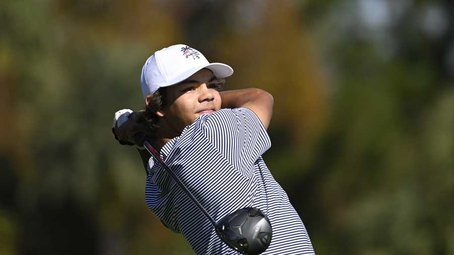 Charlie Woods tees off on the fifth hole during the first round of the PNC Championship golf tournament, Saturday, Dec. 21, 2024 in Orlando. (AP Photo/Phelan M. Ebenhack)