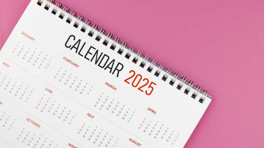 2025 desk calendar on pink background, Position with copy space.