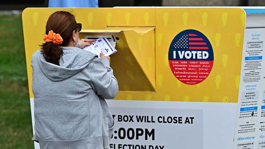 People drop off their ballots at the Los Angeles County Registrar on October 28, 2024, in Norwalk, California, two days after early voting in Los Angeles County began. Millions of US voters have already cast their ballots either by mail and drop-off boxes or in-person early voting ahead of the November 5 US presidential elections. (Photo by Frederic J. BROWN / AFP) (Photo by FREDERIC J. BROWN/AFP via Getty Images)