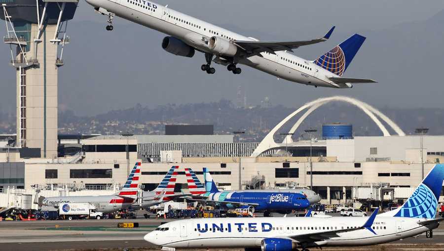 LOS ANGELES, CALIFORNIA - DECEMBER 02: A United Airlines plane takes off as another taxis at Los Angeles International Airport (LAX) following the Thanksgiving holiday on December 2, 2024 in Los Angeles, California. According to the Transportation Security Administration (TSA), Thanksgiving Sunday was the busiest day for commercial airline travel ever, with preliminary numbers indicating more than 3 million travelers were screened in U.S. airports yesterday with many people still making their way home today. (Photo by Mario Tama/Getty Images)